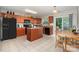 Well-lit kitchen with an island, modern appliances, and dining area at 4837 Autumn Oak Dr, Charlotte, NC 28269