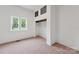 Bright bedroom featuring plush carpet, closet, and window for optimal natural light at 506 N Styers St, Cherryville, NC 28021