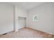 This bedroom has neutral-colored carpet and a spacious closet at 506 N Styers St, Cherryville, NC 28021