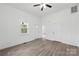 Inviting living room with new vinyl flooring, a ceiling fan, and neutral paint at 506 N Styers St, Cherryville, NC 28021