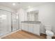 Bathroom with walk-in shower, granite counters, and white vanity providing a clean and modern look at 642 Lamorak Pl, Richburg, SC 29729
