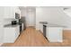 Well-lit kitchen showcases stainless appliances, granite countertops and white cabinetry at 668 Lamorak Pl, Richburg, SC 29729
