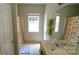Bathroom featuring neutral tones, a window, and a shower with a decorative curtain at 7046 Dorn Cir, Charlotte, NC 28212
