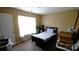 Bedroom featuring neutral paint, wood floors, a window and single bed at 7046 Dorn Cir, Charlotte, NC 28212