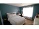 Bedroom with a large window, white linens, soft colors and a decorative vanity at 7046 Dorn Cir, Charlotte, NC 28212