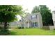 Attractive exterior view of a home with a well-maintained lawn and mature trees, showcasing curb appeal at 7046 Dorn Cir, Charlotte, NC 28212