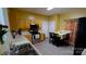 Well-lit kitchen with light wood cabinets, modern appliances, and a dining area with seating at 7046 Dorn Cir, Charlotte, NC 28212