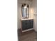 Bathroom vanity with dark gray cabinets, a white countertop, and black hardware at 804 N Main St, Oakboro, NC 28129