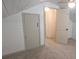 Attic bedroom with built-in storage and wood-look walls at 804 N Main St, Oakboro, NC 28129
