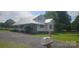 This home features a gravel driveway, manicured lawn, and covered porch, perfect for relaxing at 804 N Main St, Oakboro, NC 28129