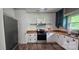 Modern kitchen with stainless steel appliances, butcher block counters and white cabinets at 804 N Main St, Oakboro, NC 28129