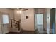 Living room with stairs, horizontal wall paneling and hard surface floors at 804 N Main St, Oakboro, NC 28129