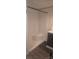 Shower stall with white walls and a built-in corner seat, next to a gray vanity at 804 N Main St, Oakboro, NC 28129