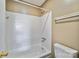A clean, well-maintained bathtub and shower with white tile and a standard shower head in the bathroom at 809 High Meadow Ln # F, Charlotte, NC 28217