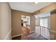 Hallway view of kitchen and living room in this home at 809 High Meadow Ln # F, Charlotte, NC 28217