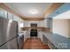 Modern kitchen with stainless steel appliances and gray countertops at 809 High Meadow Ln # F, Charlotte, NC 28217