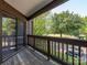 Relaxing balcony offers a serene view of lush greenery and a quiet outdoor space at 8208 Cedar Glen Dr, Charlotte, NC 28212