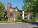 Exterior of a multi-story condominium with wood siding and inviting balconies at 8208 Cedar Glen Dr, Charlotte, NC 28212