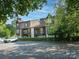 Beautiful multi-level condo building with balconies and lush green surroundings at 8208 Cedar Glen Dr, Charlotte, NC 28212