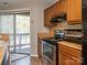 Well-equipped kitchen featuring an oven, microwave, and stove, perfect for home-cooked meals at 8208 Cedar Glen Dr, Charlotte, NC 28212