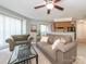Open-concept living room with a sofa, chair, and an open kitchen area at 8208 Cedar Glen Dr, Charlotte, NC 28212