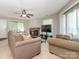 Spacious living room with a fireplace, ample seating, and natural light at 8208 Cedar Glen Dr, Charlotte, NC 28212