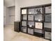 Well-organized office features an open storage unit, a closet, and carpet flooring at 8208 Cedar Glen Dr, Charlotte, NC 28212