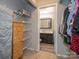 Walk-in closet with shelving and a view to an adjoining bathroom at 8208 Cedar Glen Dr, Charlotte, NC 28212