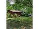 Charming single story home featuring a wood exterior and a lush green front yard at 823 Corbin St, Albemarle, NC 28001