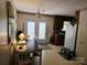 Eat-in kitchen featuring a dark table and chairs, French doors, and access to the kitchen area at 823 Corbin St, Albemarle, NC 28001