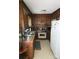 A functional kitchen with wooden cabinets, laminate countertops, and standard appliances at 823 Corbin St, Albemarle, NC 28001