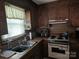 Cozy kitchen features wood-paneled walls at 823 Corbin St, Albemarle, NC 28001