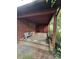 Covered patio featuring a bench and sandbags at 823 Corbin St, Albemarle, NC 28001