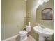 Neat half bathroom with pedestal sink and neutral decor at 9564 Kings Parade Blvd, Charlotte, NC 28273
