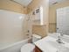 A clean bathroom with a combined shower and tub, cabinet, and sink at 9564 Kings Parade Blvd, Charlotte, NC 28273