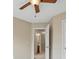 A cozy bedroom with a ceiling fan and doorway to an adjoining bathroom at 9564 Kings Parade Blvd, Charlotte, NC 28273