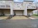 Townhome complex with garage parking in rear at 9564 Kings Parade Blvd, Charlotte, NC 28273