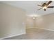 Bright, open-concept living area with ceiling fan and contemporary flooring at 9564 Kings Parade Blvd, Charlotte, NC 28273