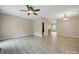 Spacious living room with sleek flooring and modern ceiling fan at 9564 Kings Parade Blvd, Charlotte, NC 28273