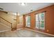 Inviting living room with wood-look flooring and ample natural light at 9564 Kings Parade Blvd, Charlotte, NC 28273