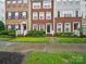 Charming brick townhomes with well-maintained landscaping and inviting entrances at 9564 Kings Parade Blvd, Charlotte, NC 28273