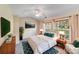 Bright bedroom with neutral tones, large windows, and elegant furnishings for a serene retreat at 9800 Walkers Glen Nw Dr, Concord, NC 28027