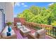 Cozy outdoor deck featuring comfortable seating, perfect for relaxing and enjoying the surrounding greenery at 9800 Walkers Glen Nw Dr, Concord, NC 28027
