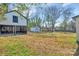 A large, grassy backyard area with a shed and other storage at 1003 S Ridge Ave, Kannapolis, NC 28083