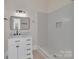 This bathroom features an elegant vanity and a glass shower with white subway tiles at 1003 S Ridge Ave, Kannapolis, NC 28083