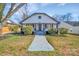 Charming home featuring a covered porch and inviting front yard landscape at 1003 S Ridge Ave, Kannapolis, NC 28083