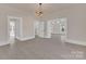 Sun-filled living room features hardwood floors and modern lighting fixtures at 1003 S Ridge Ave, Kannapolis, NC 28083