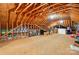 Unfinished attic space featuring exposed wood beams and floor with insulation at 102 Rosewood Ln, Locust, NC 28097
