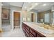 Bathroom featuring double sinks, granite countertop, and a soaking tub at 102 Rosewood Ln, Locust, NC 28097