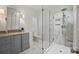 Stylish bathroom featuring marble floors, glass shower, and gray vanity at 102 Rosewood Ln, Locust, NC 28097